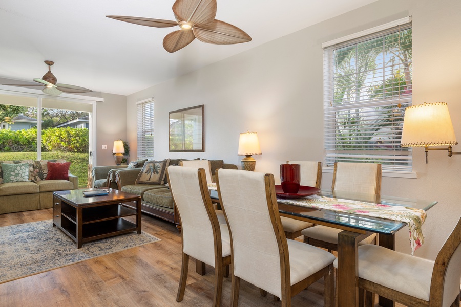 Relax in your stylish open-plan living space where tropical ceiling fans keep you cool while you dine and unwind together.