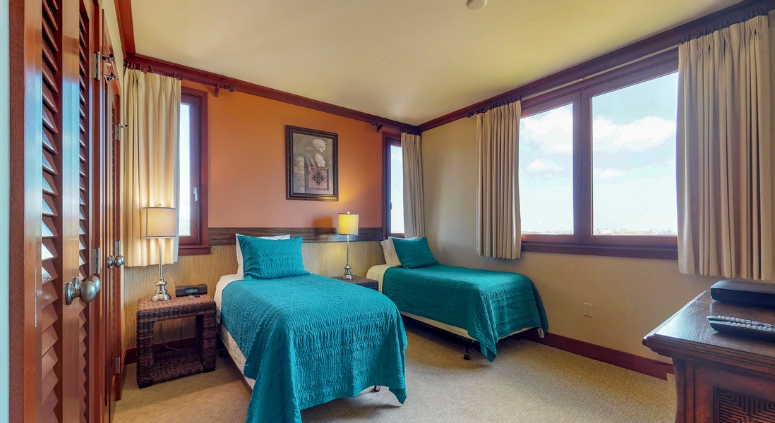The third bedroom has extra long twin beds for a restful stay.