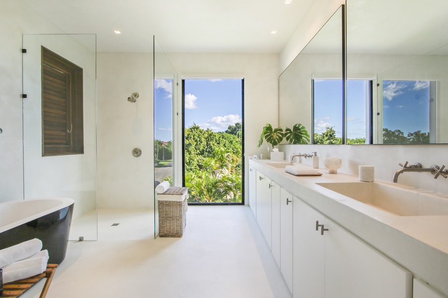 Sleek ensuite bathroom with a large shower and plenty of natural light.