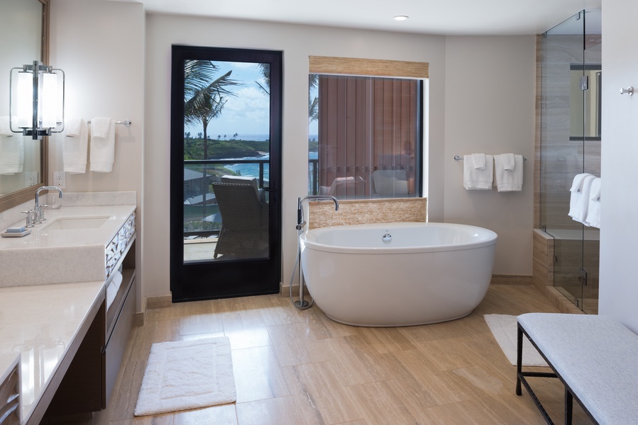Each primary bath boasts a soaking tub, a separate shower, and dual vanities.