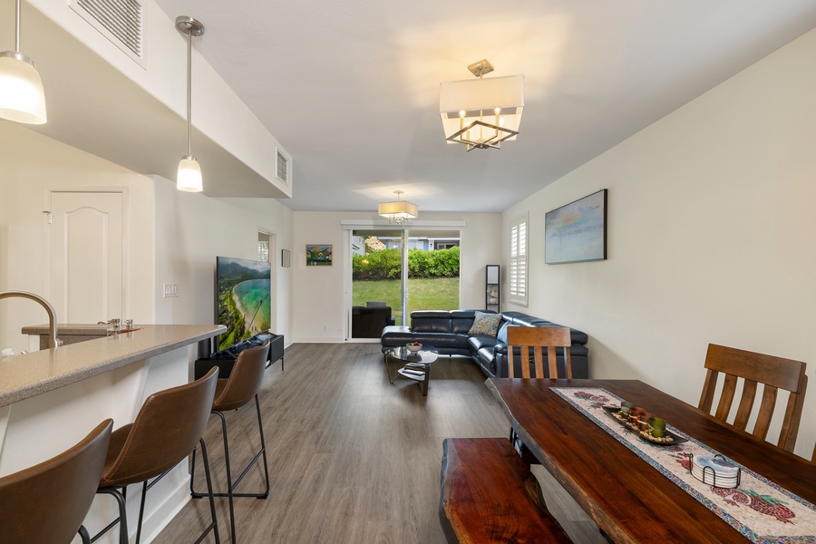 Step into your spacious open-plan retreat where natural light streams through sliding doors to the garden.