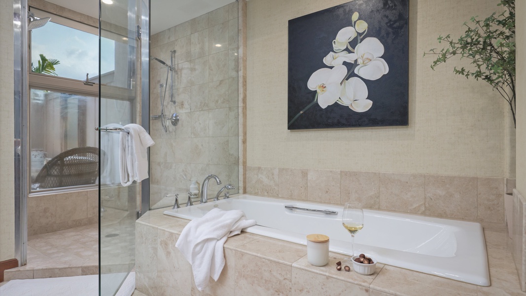 The ensuite bathroom has two vanity spaces, separate shower and a large soaking tub.