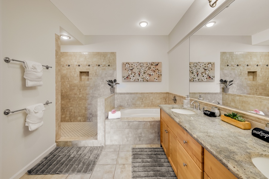 Jacuzzi tub adjacent to the large walk-in shower