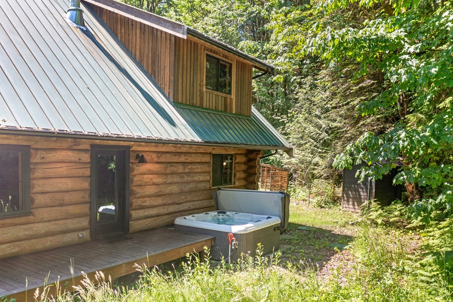 Immerse with nature while soaking up in the outdoor hot tub.