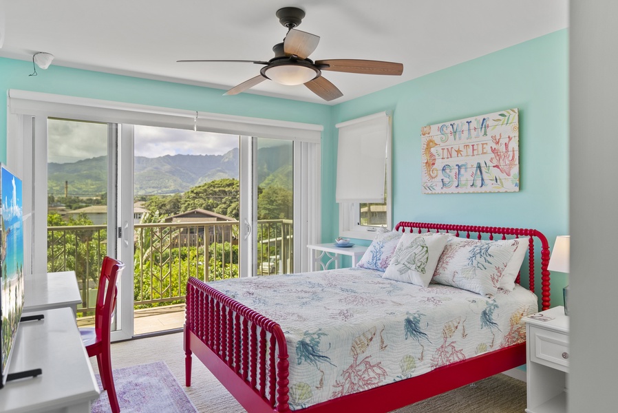 The third and fourth bedrooms, which share a Jack-and-Jill bathroom, each have a double bed, lanai with mountain views, television, and desk.