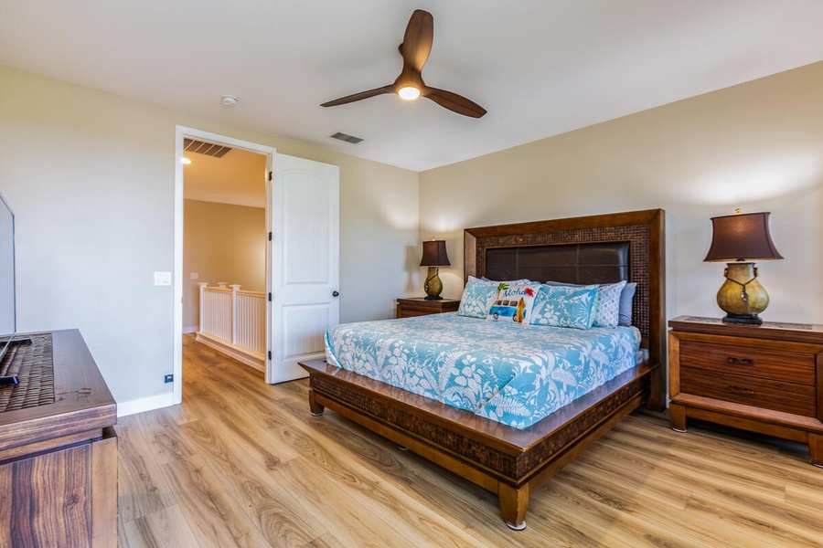 The primary bedroom grants an all-around feeling of opulence with the Smart TV, cushioned sitting area, and daybed.