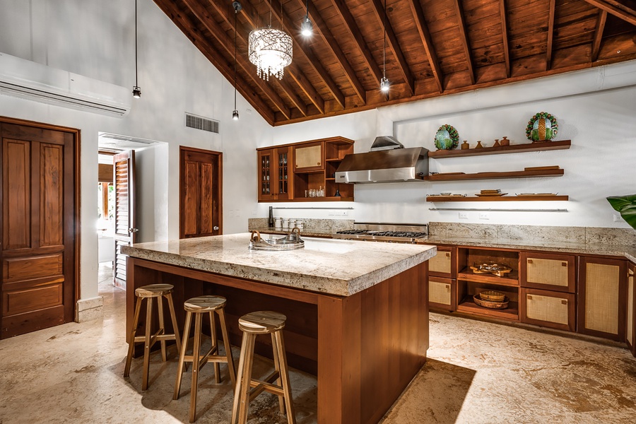 The expansive kitchen is a chef's delight featuring the kitchen bar with seating for three.