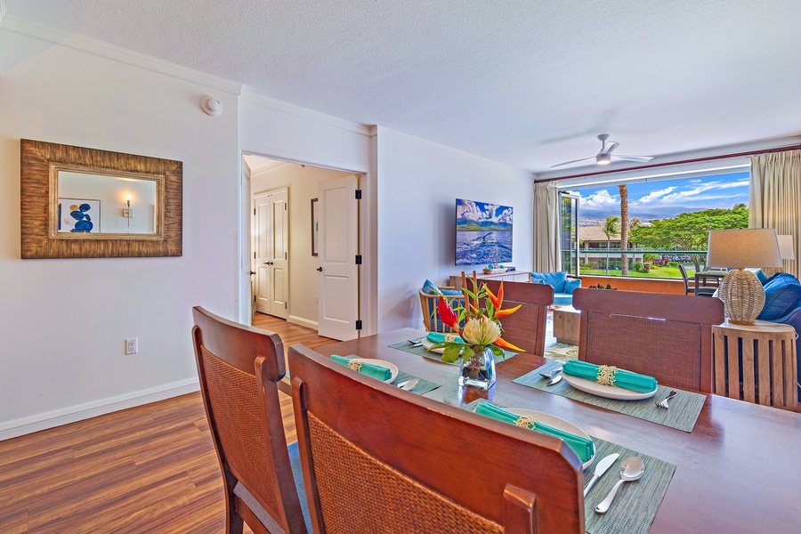 The dining area flows into the open living space, offering a bright and inviting atmosphere with views of the outdoors