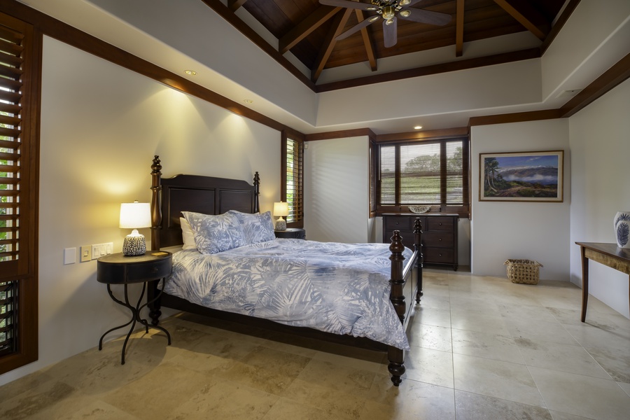 Retreat to your spacious bedroom with vaulted wooden ceilings and tropical elegance, where comfort meets island sophistication.