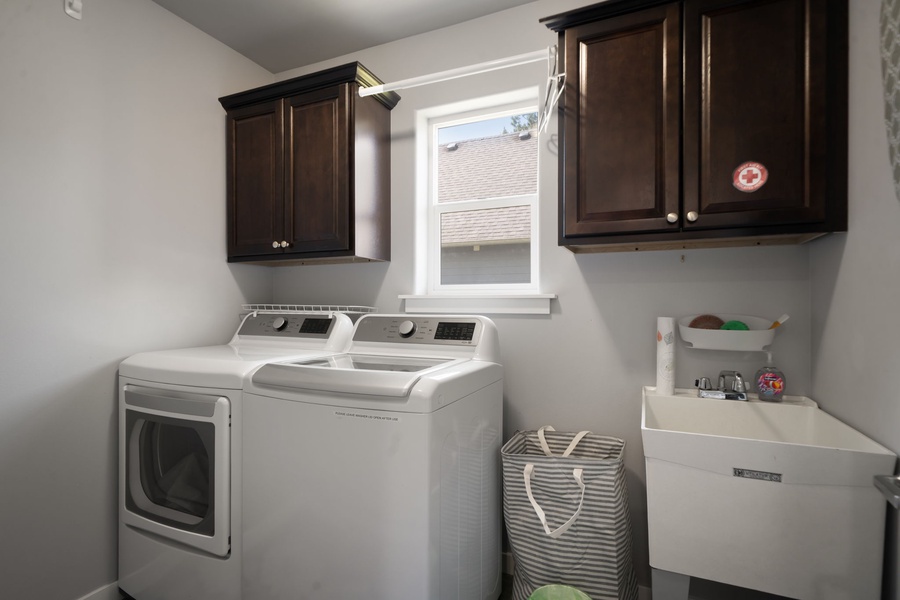 Enjoy the convenience of a full in-home laundry area with washer, dryer, and additional storage space.