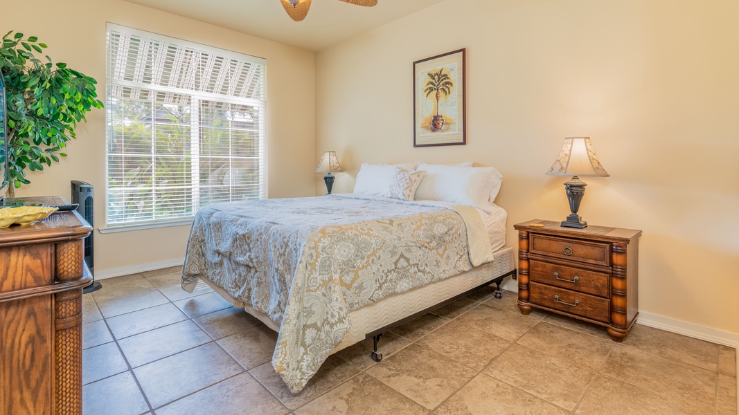 The primary guest bedroom is comfortable and spacious for a restful slumber.