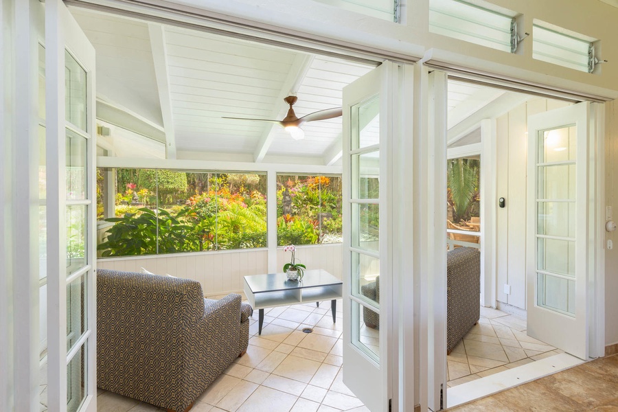 Screened lanai offers privacy and a cozy space to read, or enjoy a cup of Kona coffee