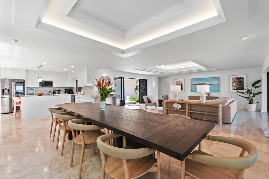 Open-concept layout connecting kitchen, dining, and living in one fluid space.