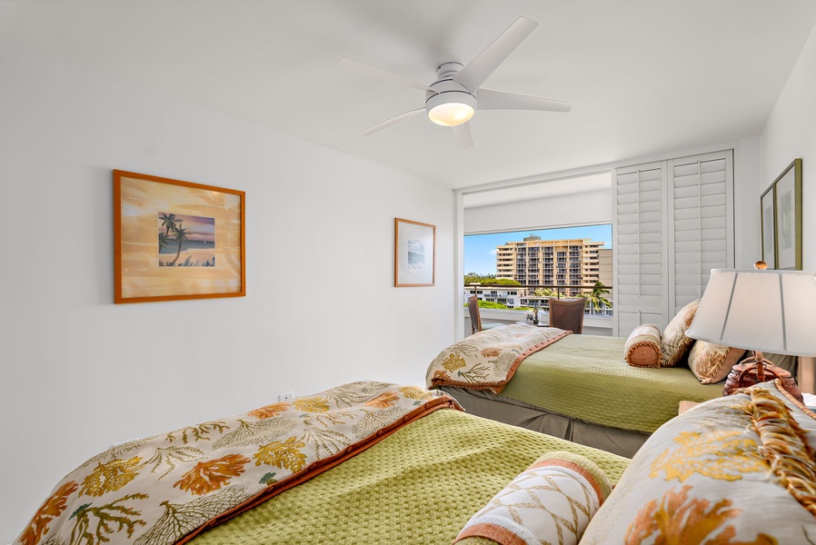 A queen and a double bed in the guest suite are complemented by city and ocean views, inviting in light and breeze.