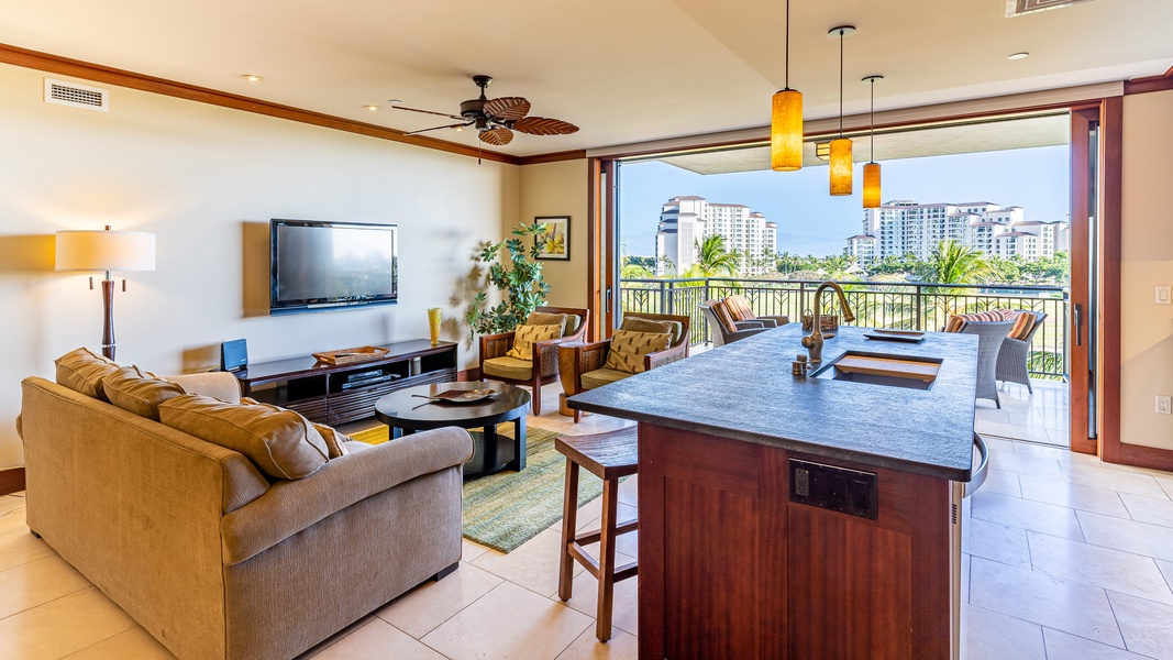 The open floor plan with living room, dining, kitchen and TV.