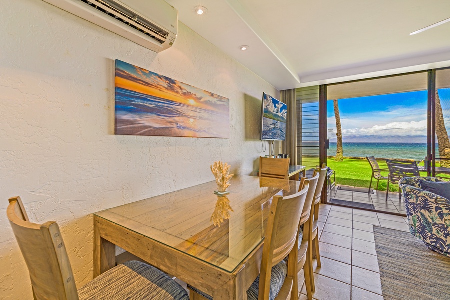 This elegant dining table offers an ideal spot to enjoy your meals with a backdrop of ocean views and tropical breezes