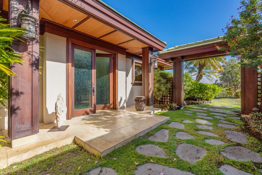 Garden path entrance leading to peaceful guest suite.