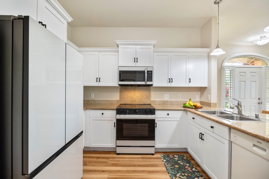 Cook up delicious meals in a sleek kitchen with ample space and all the essentials.