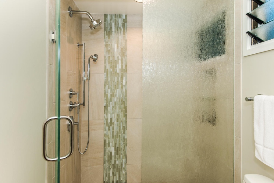 Pool House newly remodeled bathroom with a sleek walk-in shower and spa-like finishes.