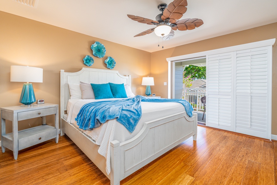The primary guest bedroom upstairs is a beautiful coastal escape.