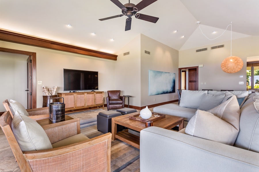 Vaulted ceilings and recessed lighting in the spacious living area.