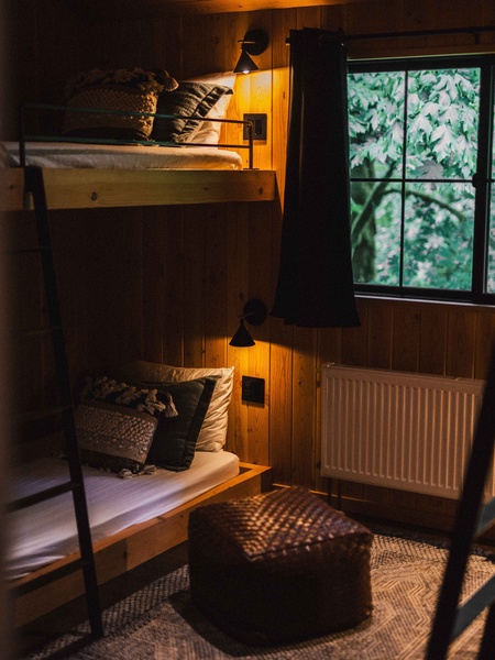 The bunk room offers a cozy retreat for kids, friends, or group getaways.