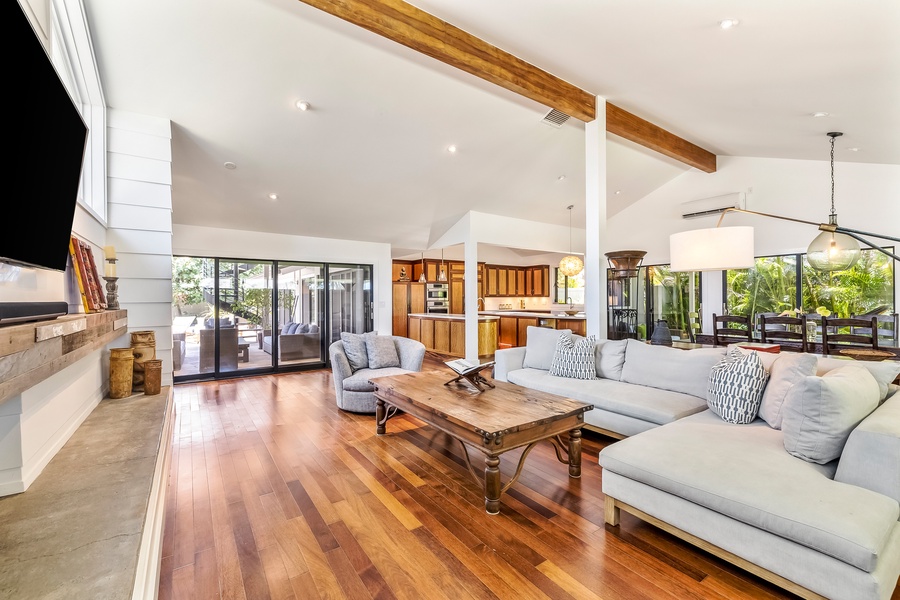 Just through the sliding doors, you'll encounter the tranquil pool deck and covered lanai