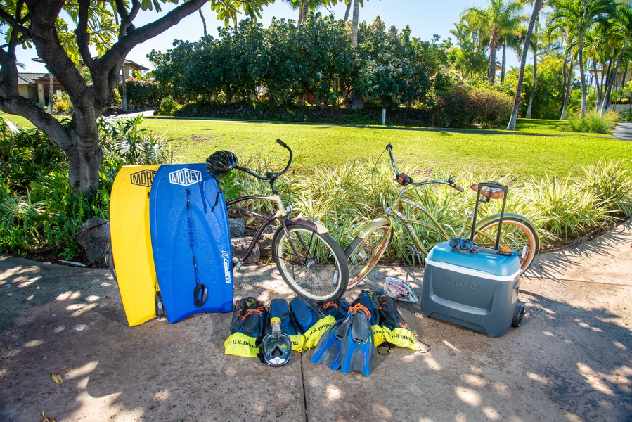 Outdoor equipment, including snorkel gear, boogie boards, bicycles, and cooler, ready for your adventures.