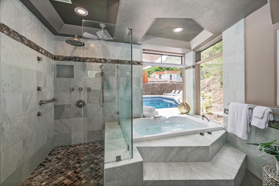 Walk-in shower and soaking tub in the primary ensuite