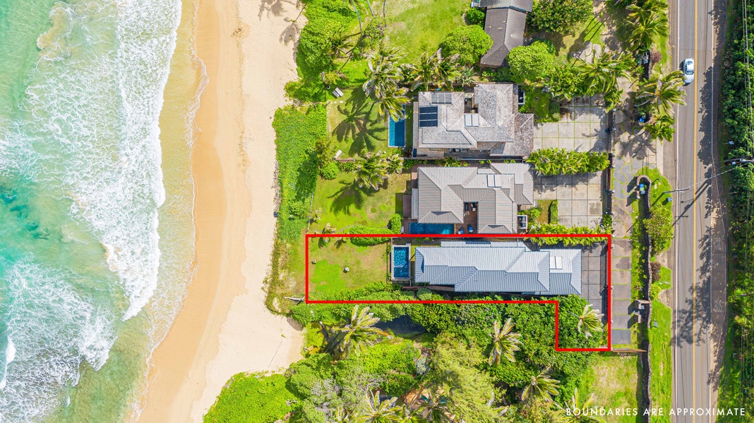 Overhead view of the property showcasing its beachfront location and spacious grounds.