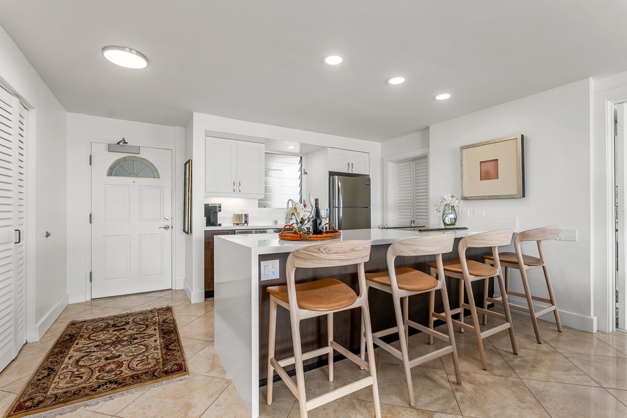 Everything you need, right at your fingertips—from a stainless steel refrigerator to ample prep space, this kitchen helps you vacation like a local.
