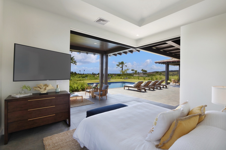 Primary bedroom with pool and ocean views