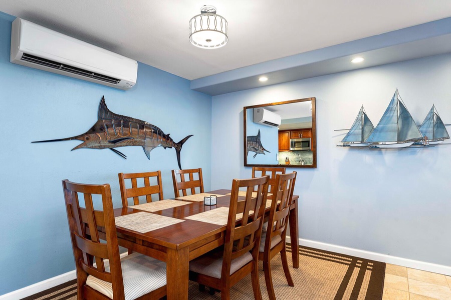 Dining area with split AC and table for six.