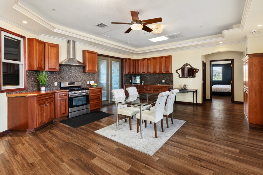 A second kitchen picks up the overflow when sixteen sit down to eat.