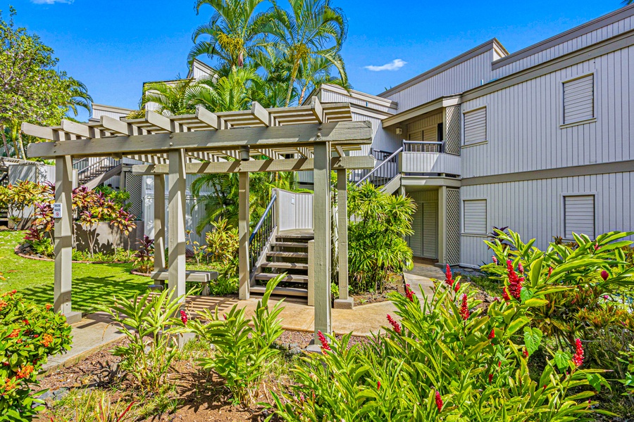 Lush landscaped path welcomes you to Wailea Ekolu 1605, your serene Maui escape.