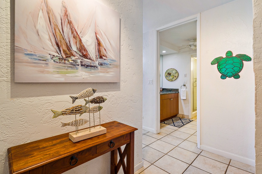 This charming entryway features nautical decor, creating a welcoming ambiance as you step into your relaxing vacation home.