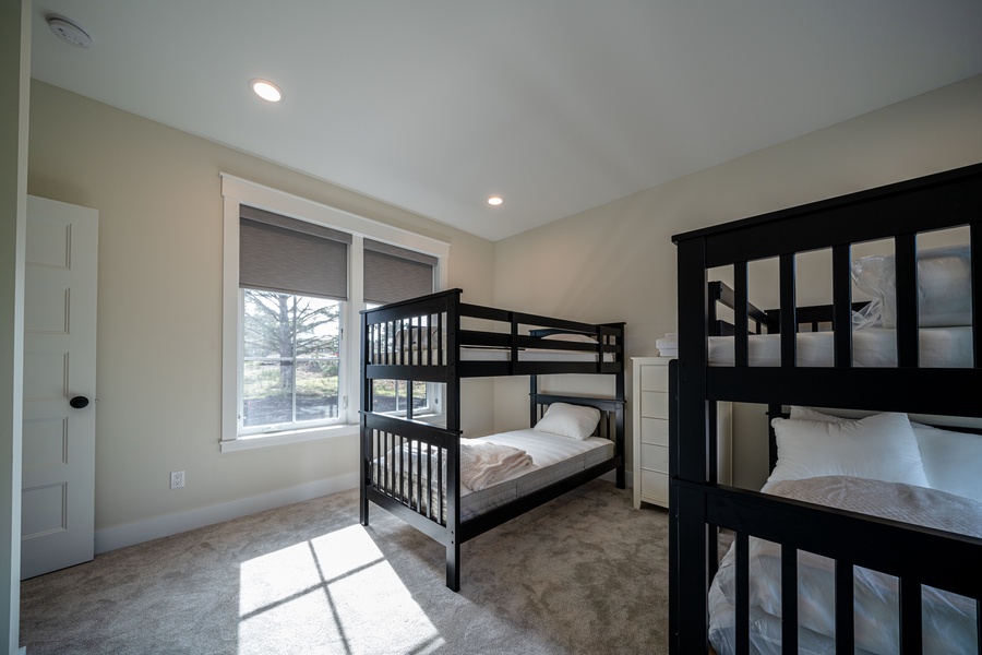 Guest bedroom 4 is the perfect kids' room as it is furnished with two sets of bunk beds – a pair of twin beds and a pair of packed beds, accommodating a total of 6