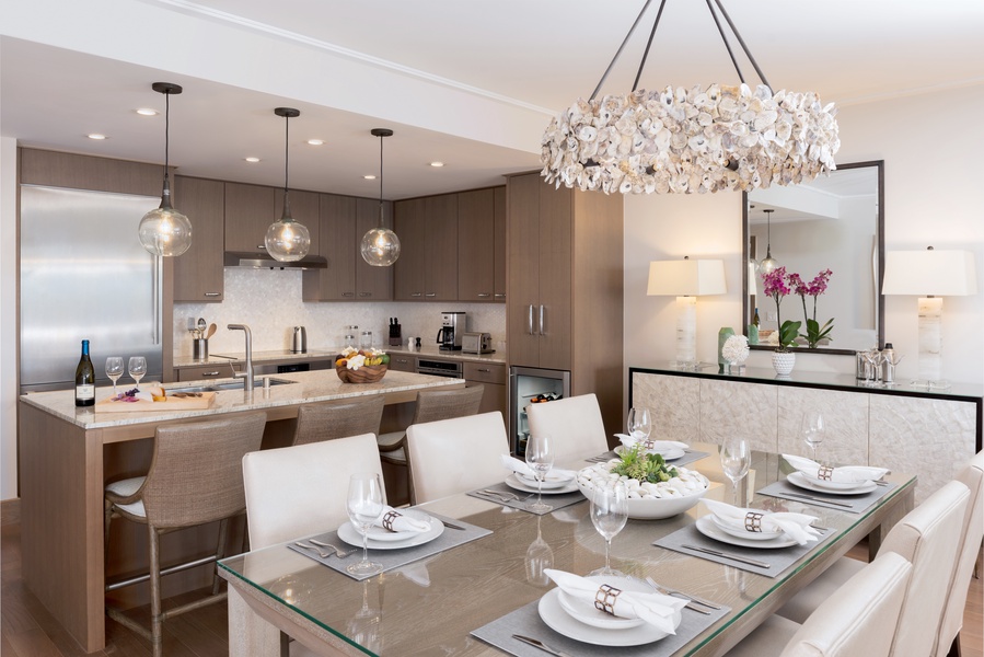 The residences feature formal dining spaces as well as bar seating in sleek, well-equipped kitchens.