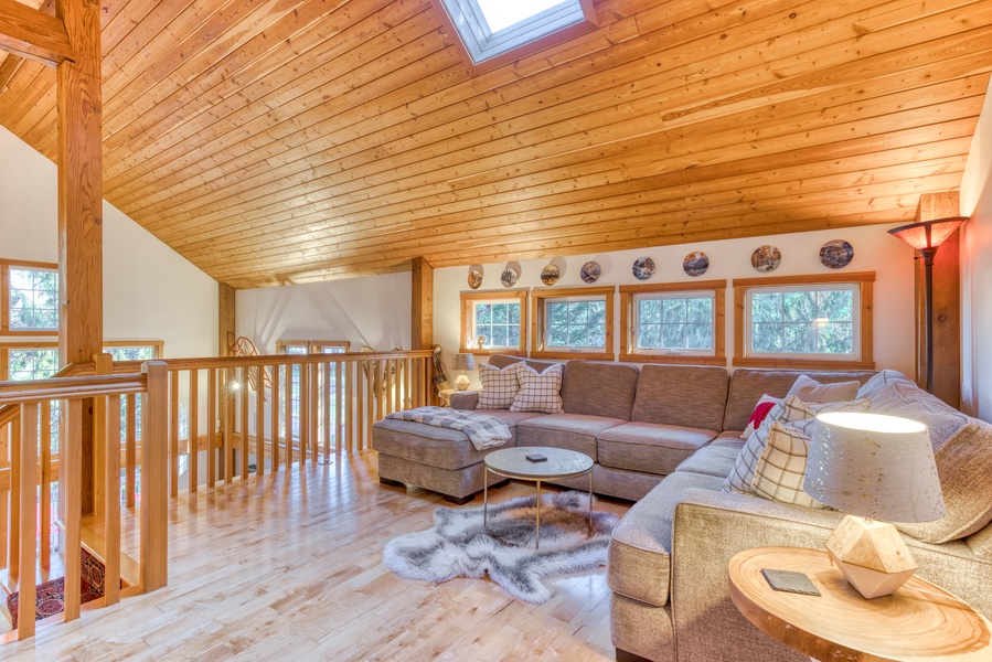 Discover a cozy retreat in the loft area, offering an additional living space for relaxation or entertainment.