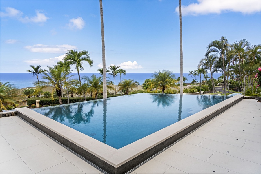 Iconic Big Island living: an infinity pool, palms, and uninterrupted Pacific views.