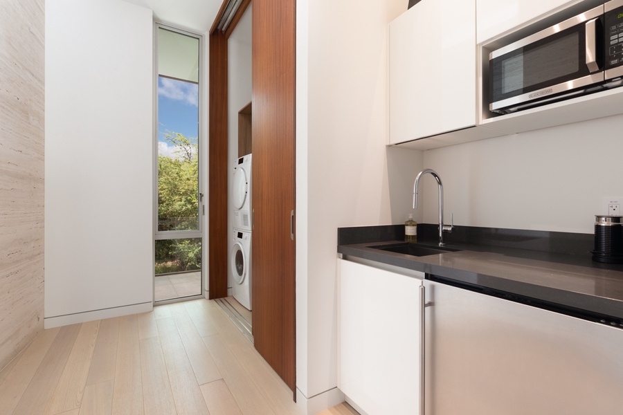 Luxury kitchenette with premium appliances, ideally situated by Bedroom 4 for added convenience.