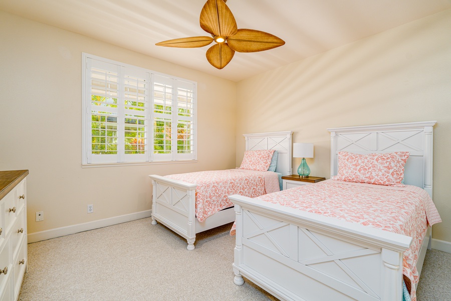 Guest bedroom with two twin beds.