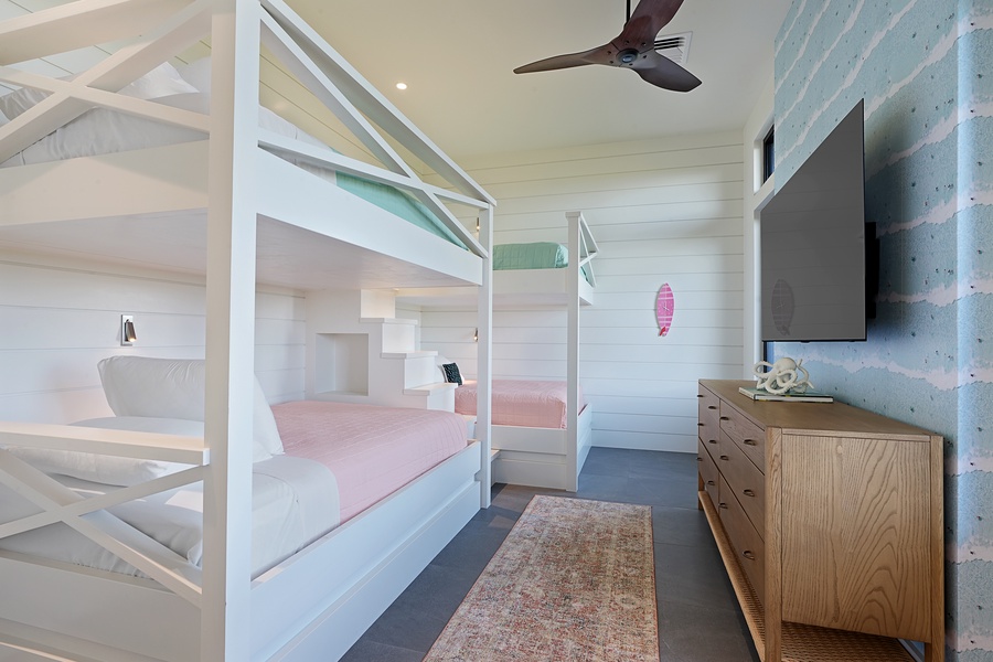 Cozy bunk room with dual bunk beds, perfect for kids or groups to unwind.