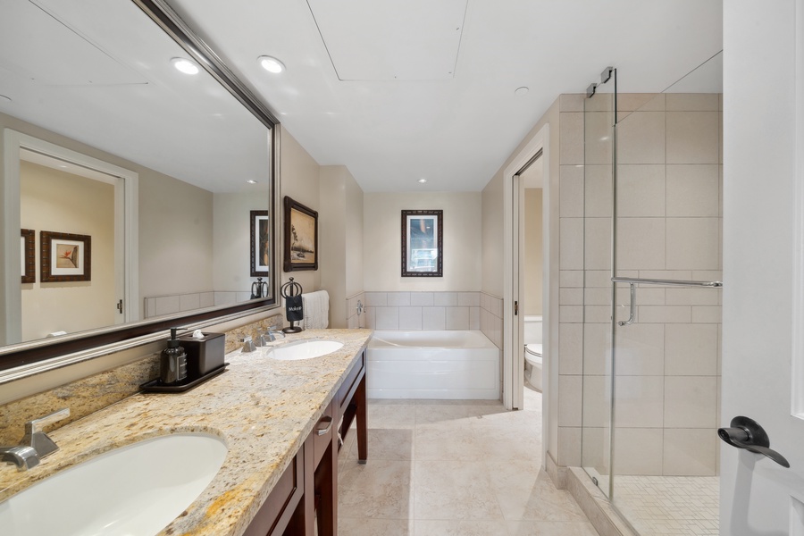 Honua Kai Konea 204’s spa-inspired ensuite bath offers a soaking tub, walk-in shower, and dual vanities for two.
