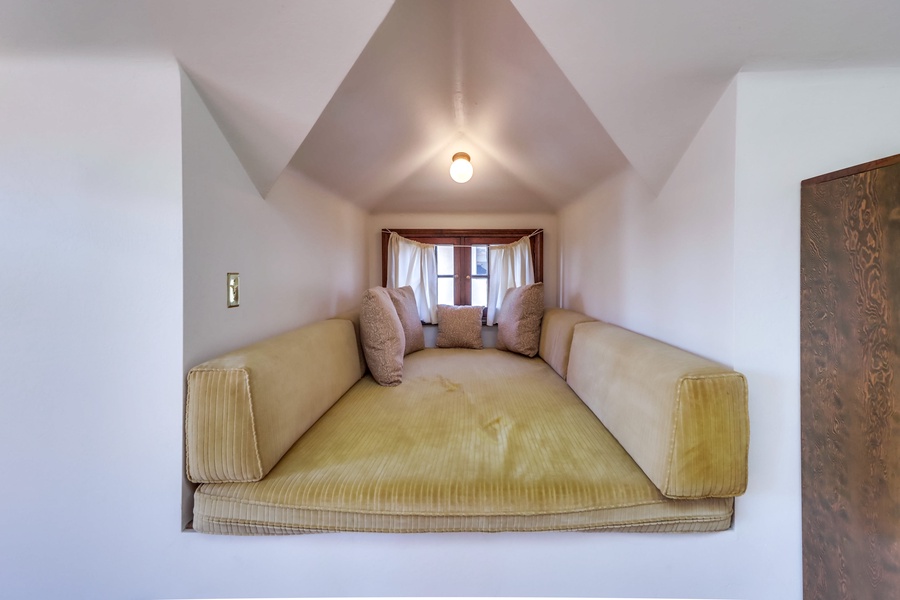 Find your perfect escape in this snug alcove, ideal for curling up with a captivating book and losing track of time.