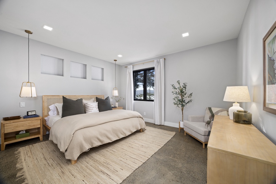 Primary bedroom retreat with soft tones, natural textures, and calming views — unwind in effortless comfort.