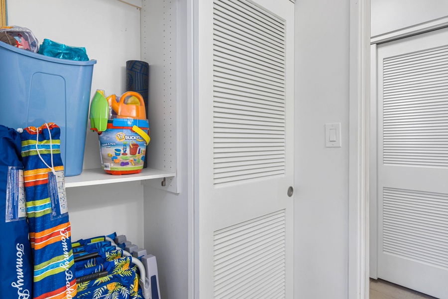 This storage closet is stocked with beach essentials, ensuring you're ready for a fun day in the sun.