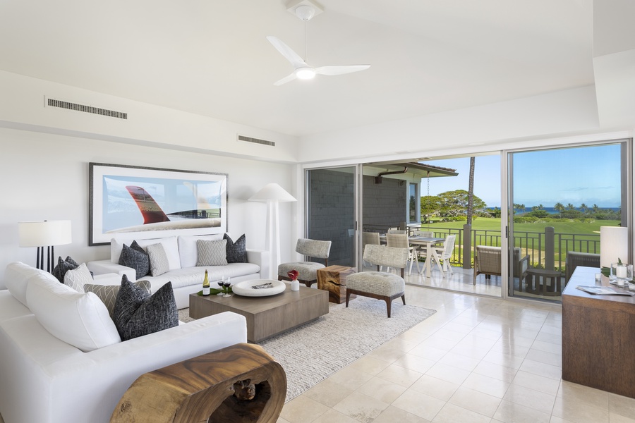 Relax in your elegant living space with sweeping golf course views from floor-to-ceiling windows that open to your private balcony.
