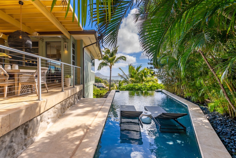 Soak up the sun or unwind poolside with seamless indoor-outdoor access and lush surroundings.