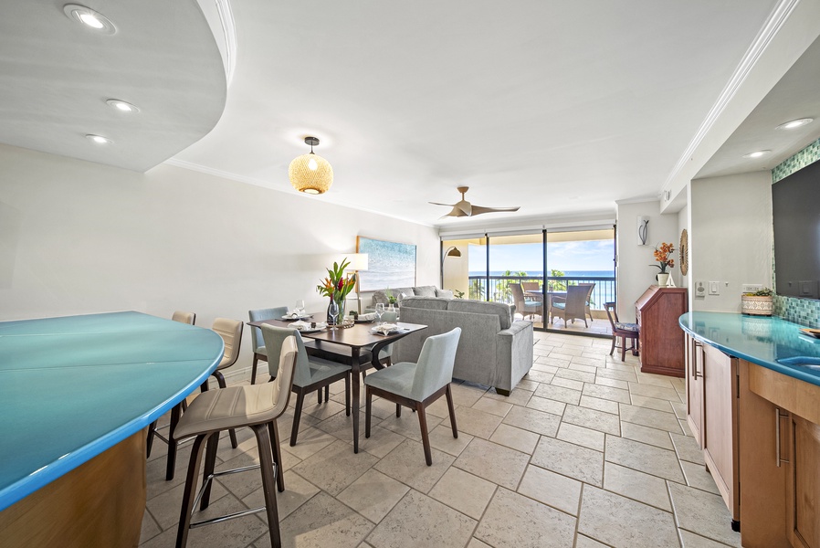 Savor meals in the cozy dining area while enjoying ocean views through floor-to-ceiling windows.
